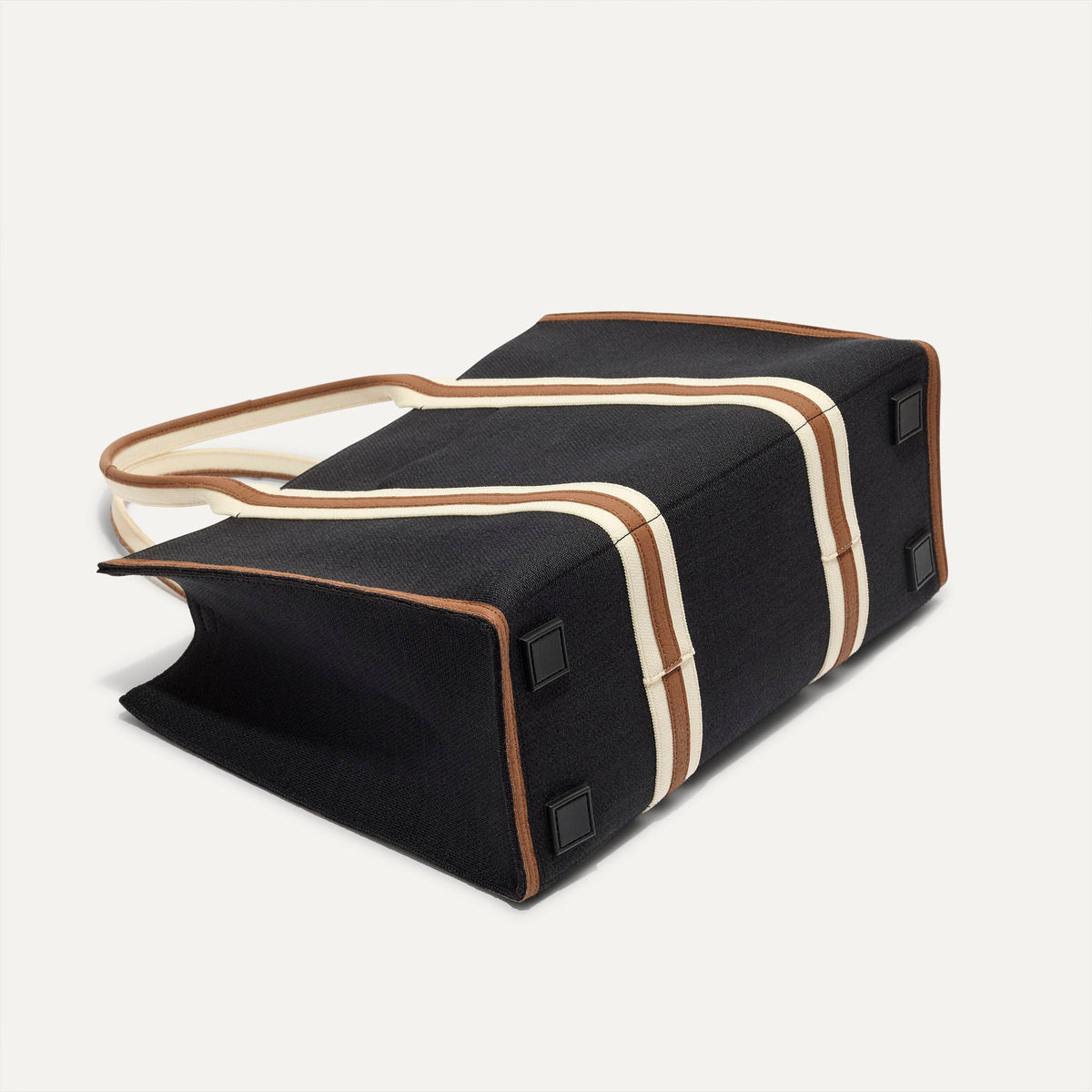 The Classic Tote in Black Coffee, shown from the bottom.