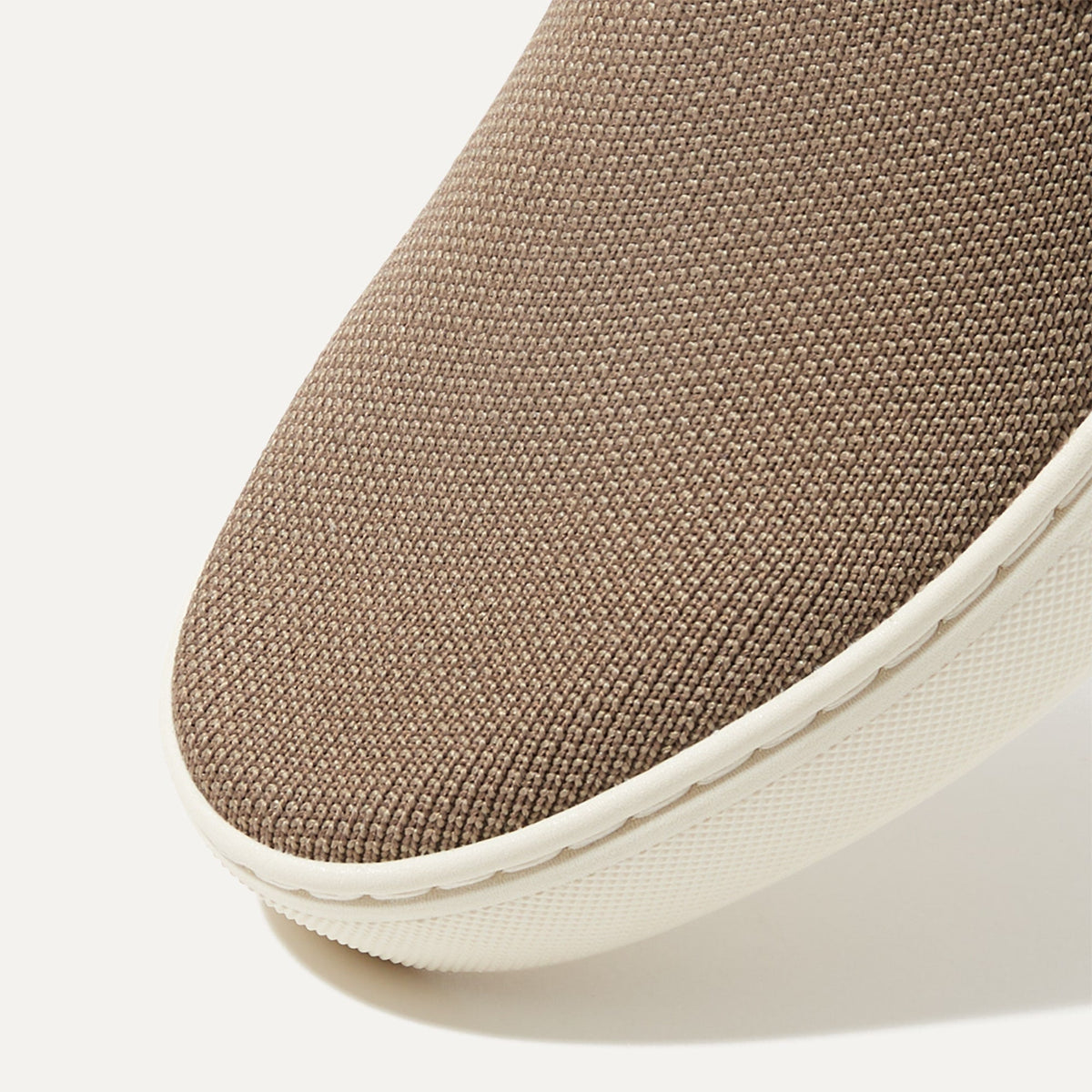 Close up of the toe and vamp of The Sneaker in Latte.
