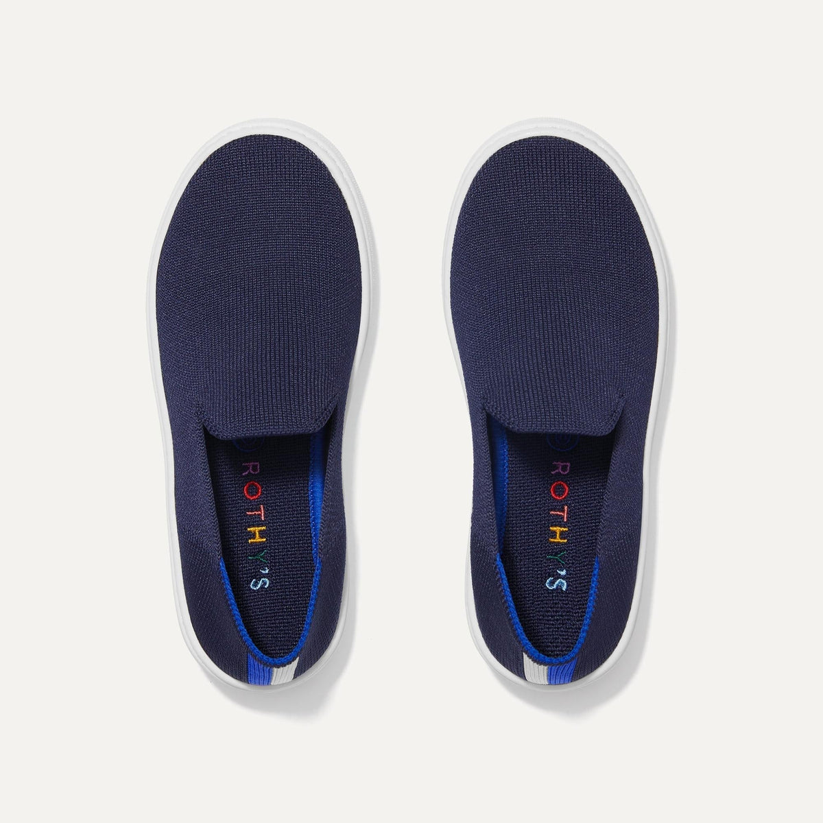 A pair of The Kids slip-on Sneakers in Deep Navy shown from the top view.