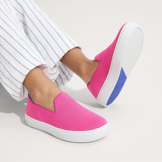 hover | Model wearing The Kids Sneaker in Bubblegum.