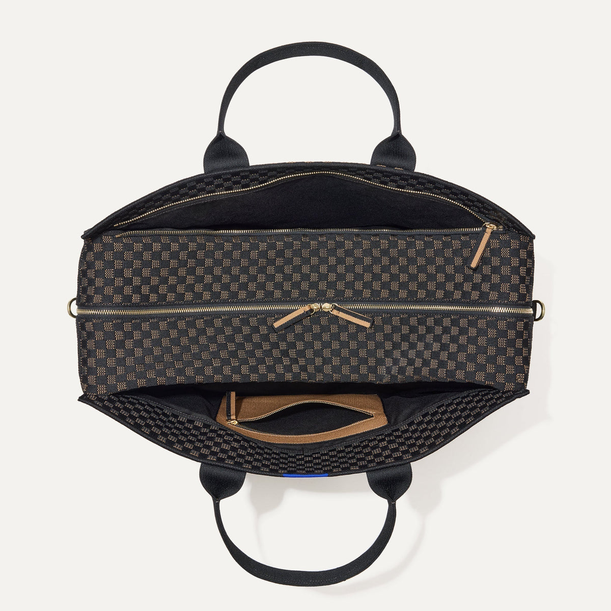 The Weekender in Night Song shown from the top with zipper side compartment and magnetic side compartment open.