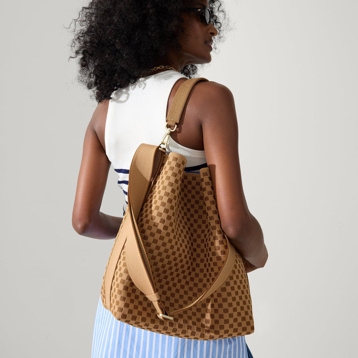 hover | The Bucket Bag in Hazelnut shown on model.