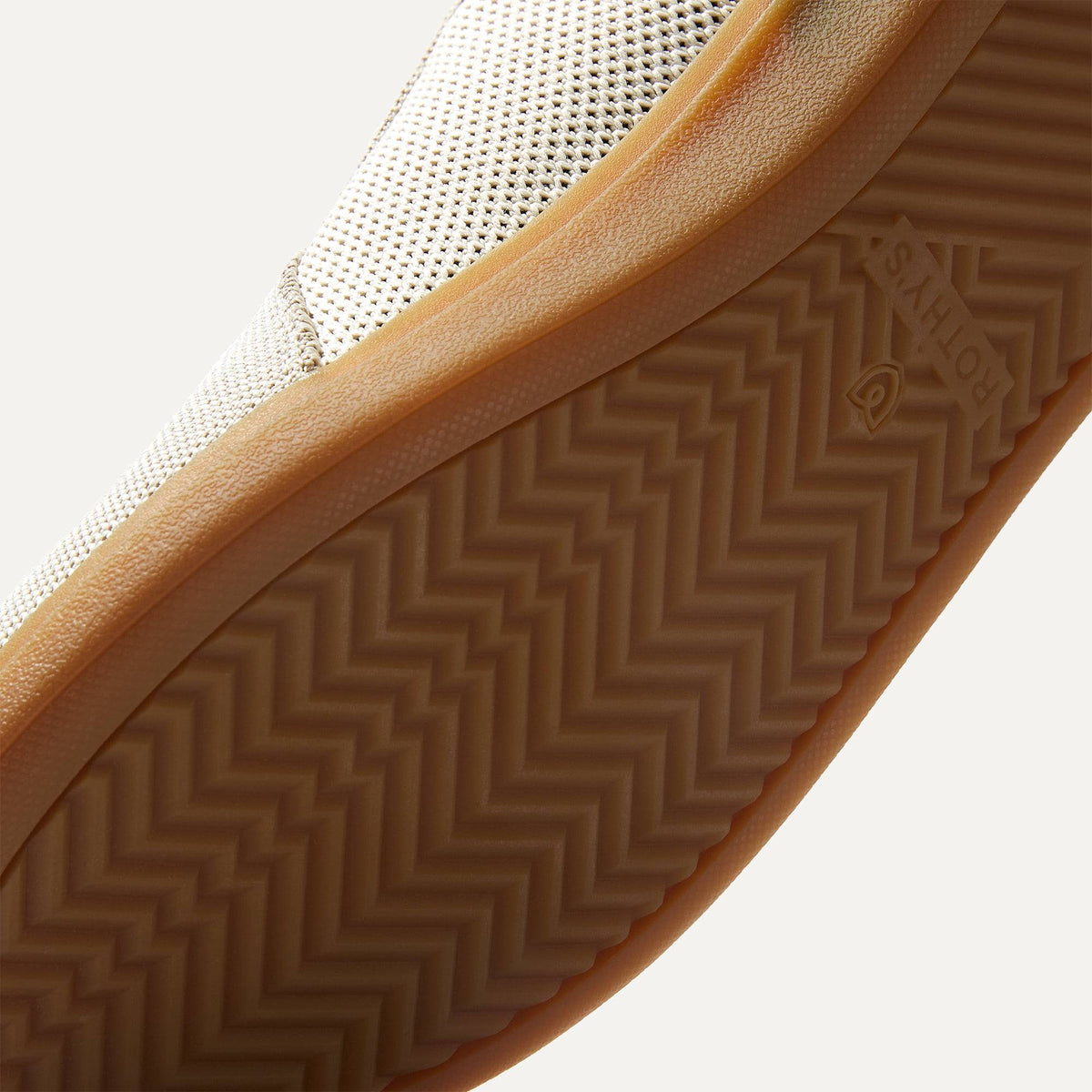 Close up of the outsoles of The RS01 Sneaker in hudson, with raised grooves for added traction.