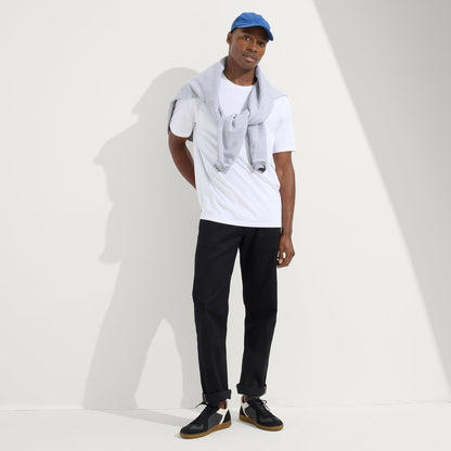 model | Alternate view of a model wearing The RS01 Sneaker in Obsidian Black.
