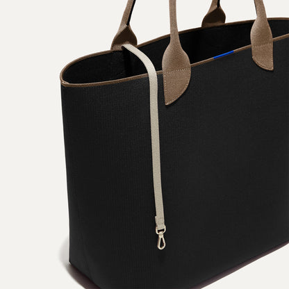 The Lightweight Tote in Black Portobello shown with its handy key leash.