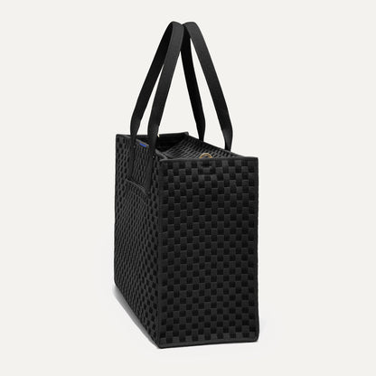 The Classic Tote in Black Sand, shown from the side.