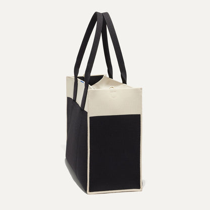 The Classic Tote in Luna, shown from the side.
