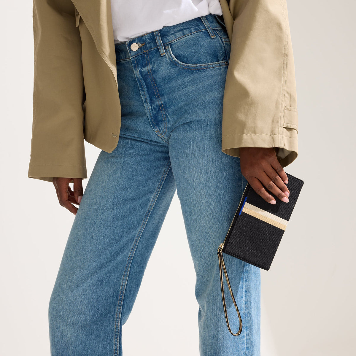 hover | The Wallet Wristlet in Black Portobello Stripe, shown packed into The Lighweight Petite Tote by a model.