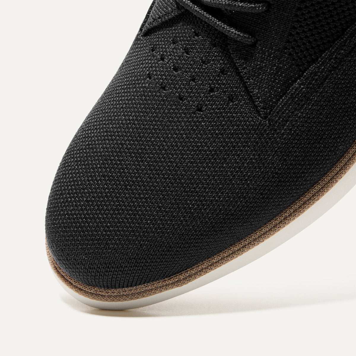 The toe and vamp of The Oxford in Black, in diagonal view.