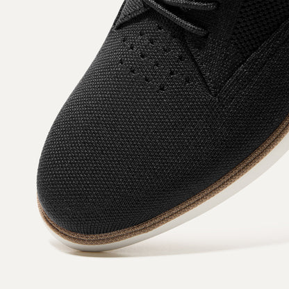 The toe and vamp of The Oxford in Black, in diagonal view.