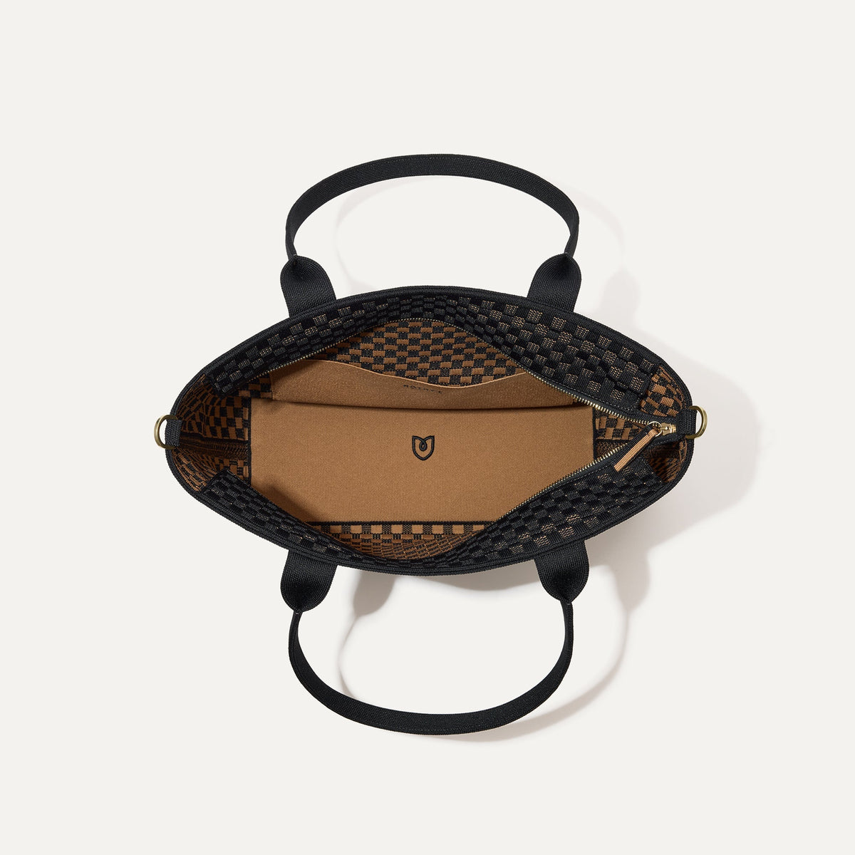 The Lightweight Zip Tote, shown from above with the interior exposed.