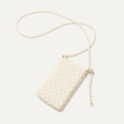 The Phone Crossbody in White Sand shown from the back.