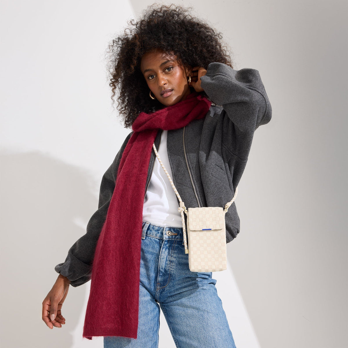 hover | Model wearing The Phone Crossbody in White Sand.