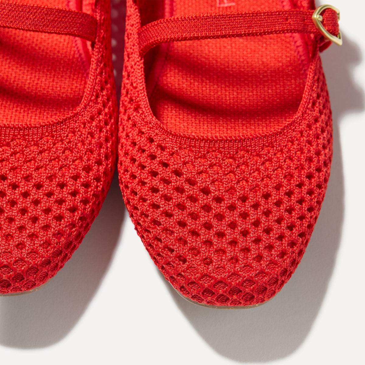 Close up of the toe and vamp of The Double Buckle Mary Jane in Bright Red Mesh.