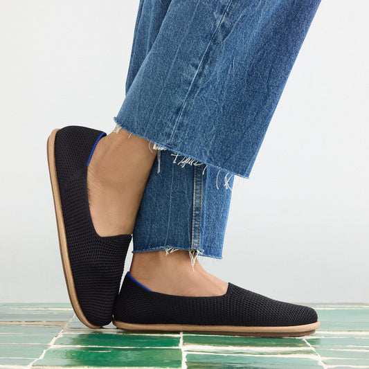 hover | Model wearing The Cruiser Loafer in Black Raffia-Knit.