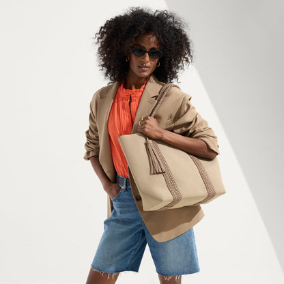hover | Model holding The Lightweight Tote in Caramel Twist.