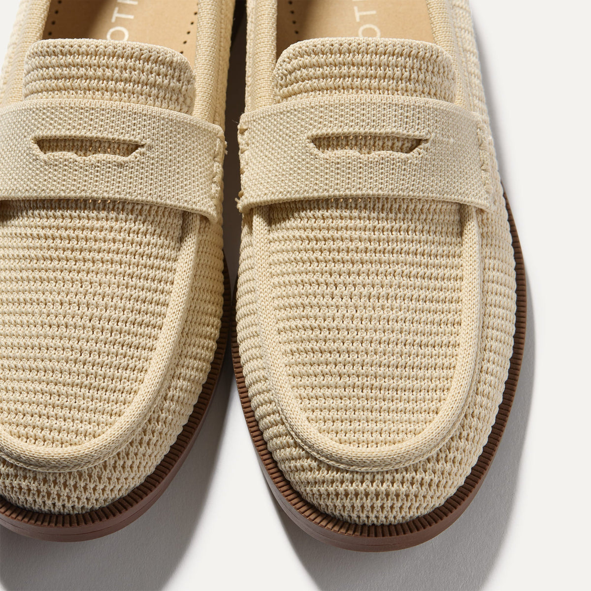 Close up of the toe and vamp of The Penny Loafer in Conch Raffia-Knit.