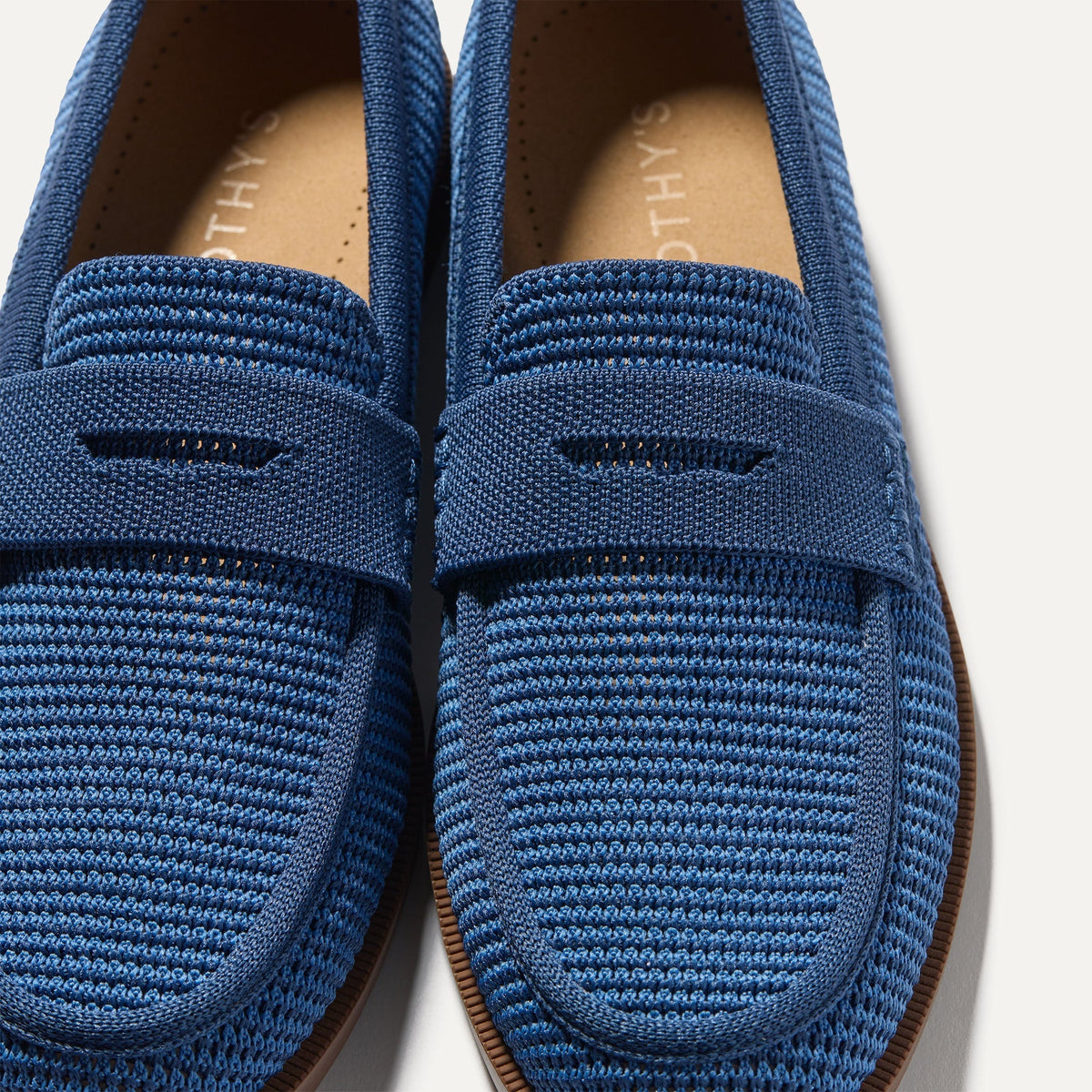 Close up of the toe and vamp of The Penny Loafer in Blue Raffia-Knit.