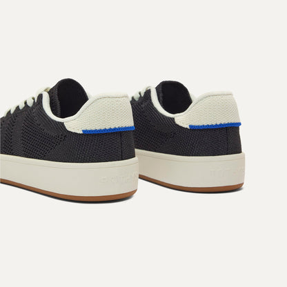 Close up of the heel of The Kids Stretch Sneaker in Zoom, with Rothy's signature blue halo.